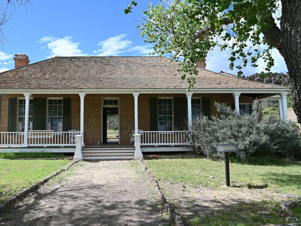 Stone ranch home with a wide front porch